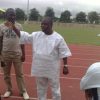 Ogba explains his point to his coaches and athletes